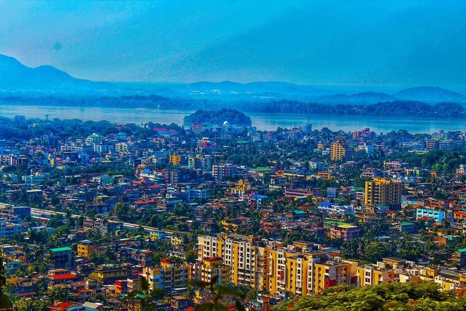 Aerial view of Guwahati with the Brahmaputra River and hills in the background